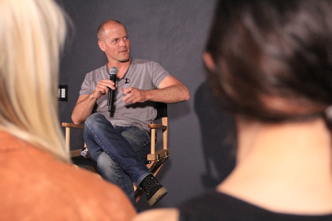 Company director speaking during a filmed expert panel discussion
