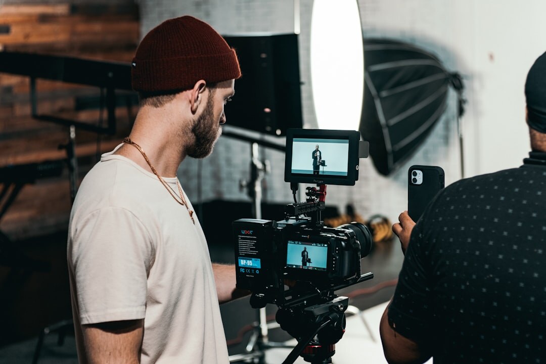 Behind the scenes photo of a video production team reviewing a monitor