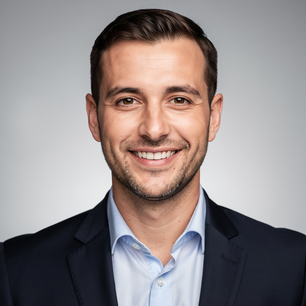 Studio portrait of a Slovenian media producer with a friendly smile