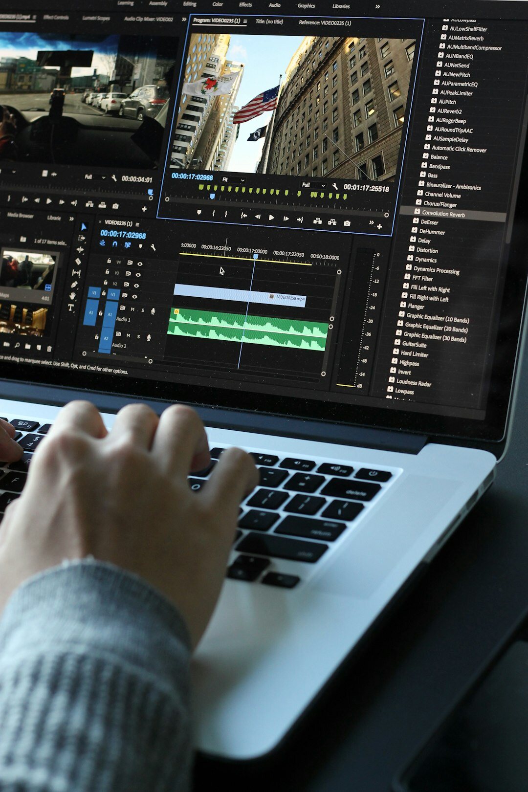 Video editor reviewing footage on a laptop after a studio recording